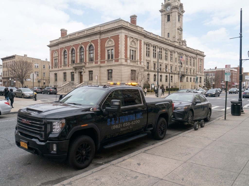 S & J Towing Truck operating in front of Paterson City Hall in Passaic County, NJ