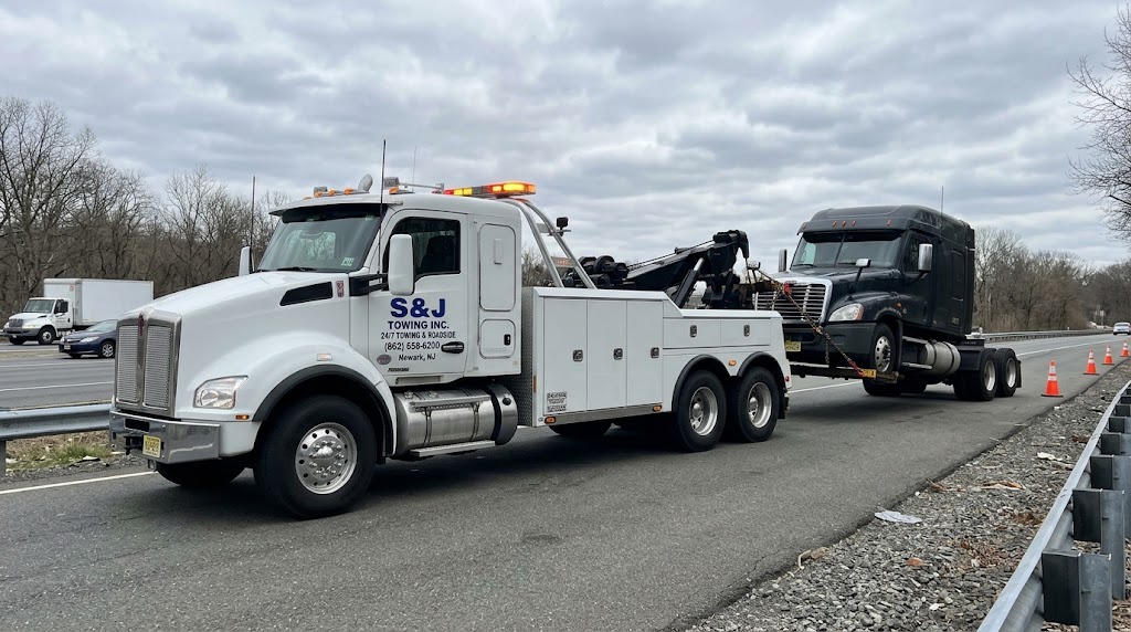 Semi truck towing on New Jersey highway by S&J Towing